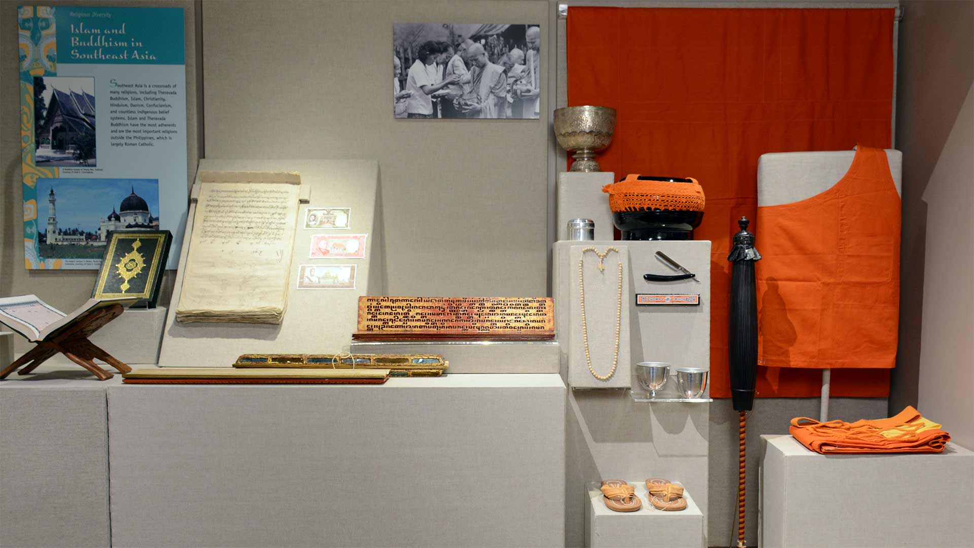 exhibit case photo with monk possessions