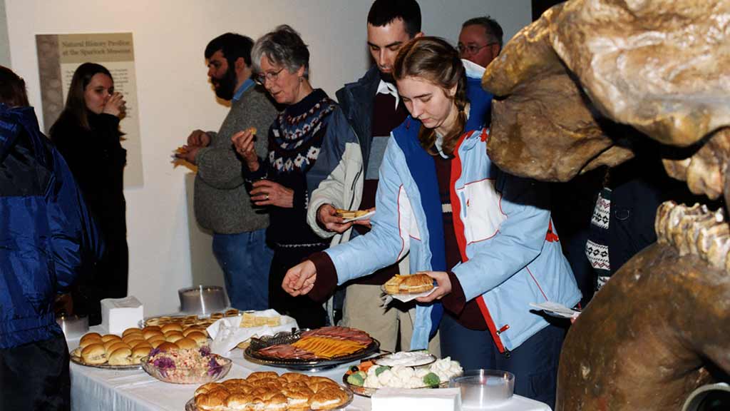 museum visitors enjoy a public reception with hor d'oeuvres